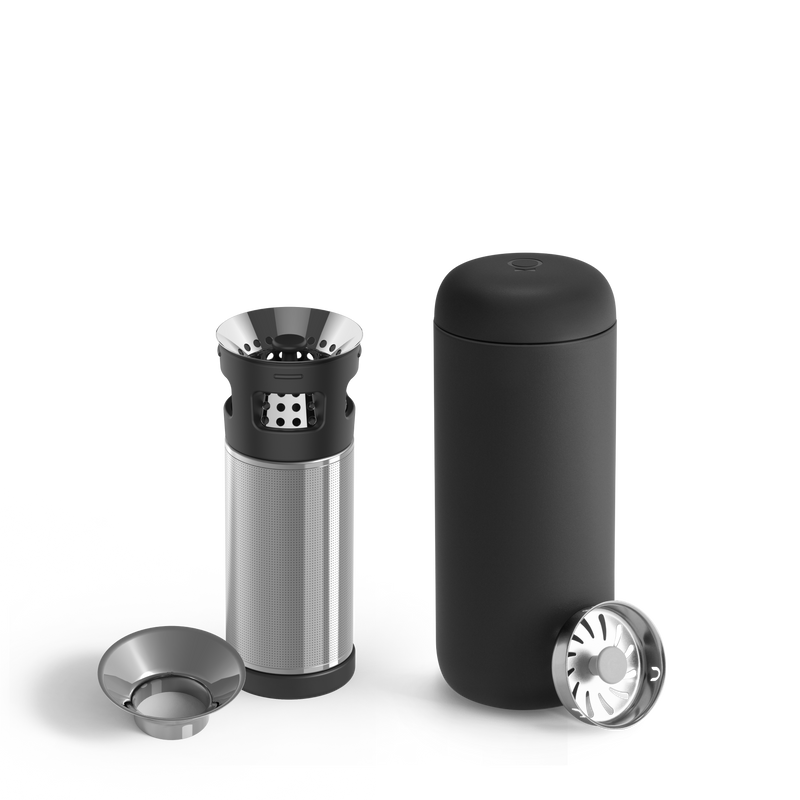 The Fellow Carter Infuser Set is a sleek black cylindrical coffee maker with a minimalist design for cold brew lovers. It features a disassembled stainless steel filter basket, two lids, smooth curves, and metallic accents, perfectly complementing the Carter Move Mug or tea infuser.